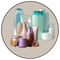 Care collection of various beauty and personal care products including bottles, jars, and a hairbrush.