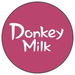 Logo featuring the text 'Donkey Milk' on a pink background, representing the donkey milk collection.