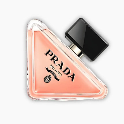 Prada Paradoxe Eau De Parfum For Women 90ml in a triangular bottle with a black cap, showcasing an elegant design.