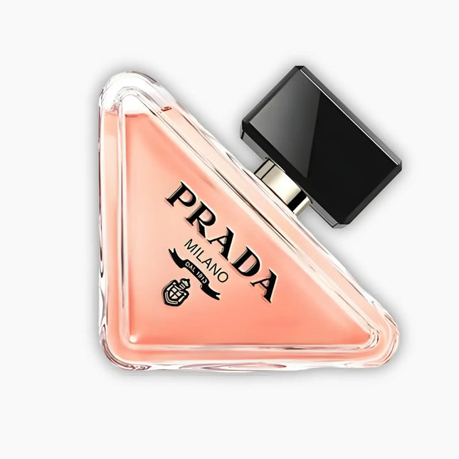 Prada Paradoxe Eau De Parfum For Women 90ml in a triangular bottle with a black cap, showcasing an elegant design.