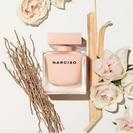 Narciso Rodriguez Poudree Eau De Parfum 90ml bottle surrounded by floral accents and natural elements.