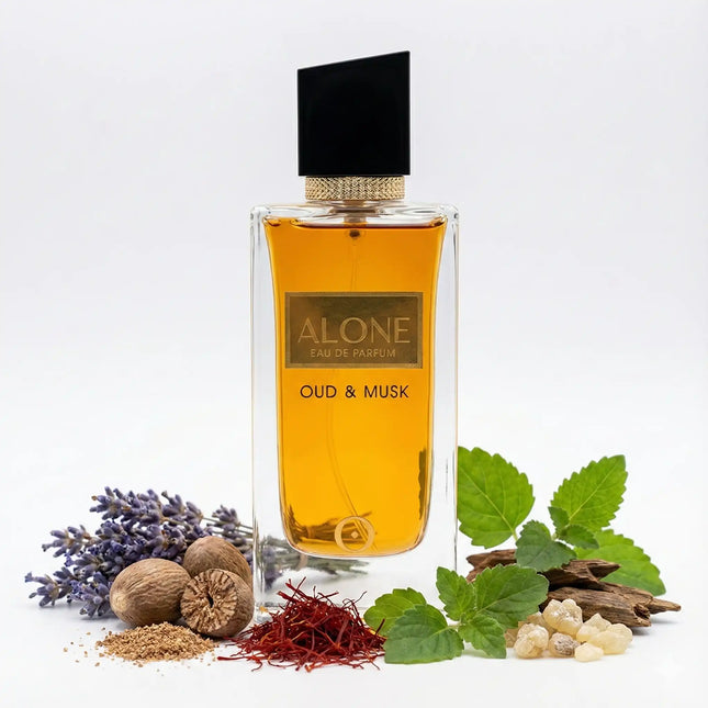 Alone Oud and Musk Eau De Parfum in a stylish bottle surrounded by lavender, spices, and herbs.