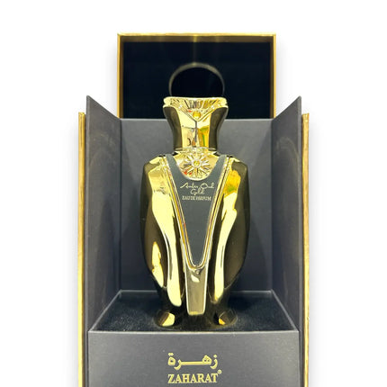 Zaharat Amber Oud Gold Eau de Parfum 100ml in a luxurious gold bottle displayed in packaging.