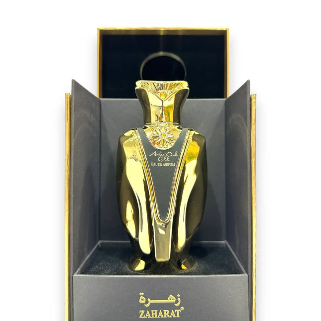 Zaharat Amber Oud Gold Eau de Parfum 100ml in a luxurious gold bottle displayed in packaging.