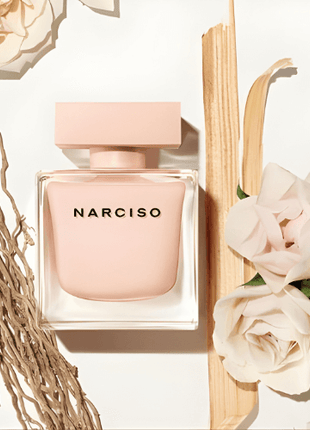 Narciso Poudree Eau de Parfum 90ml bottle surrounded by roses and natural elements.