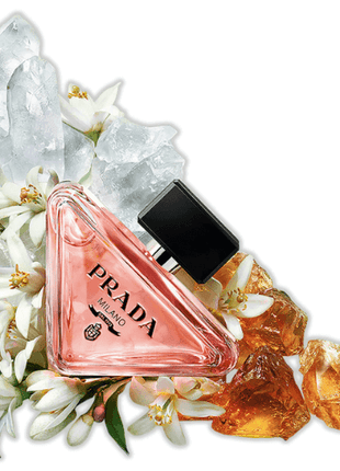Prada Paradoxe Eau de Parfum 90ml showcased with floral and crystal elements, highlighting its luxurious appeal.